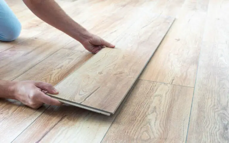 Where should you not put laminate flooring?